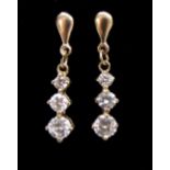 PAIR OF GRADUATED DIAMOND DROP EARRINGS each earring with three diamonds totalling approximately 0.