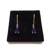 PAIR OF PEAR CUT SAPPHIRE DROP EARRINGS in unmarked gold