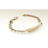 NINE CARAT GOLD IDENTITY BRACELET the blank panel on curb link bracelet, approximately 14.