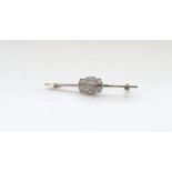 EDWARDIAN DIAMOND SET BAR BROOCH in nine carat white gold,