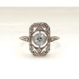 ART DECO STYLE BLUE TOPAZ AND DIAMOND PLAQUE RING the central round cut blue topaz in diamond set