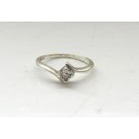 DIAMOND SOLITAIRE RING on nine carat white gold shank,