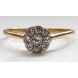 DIAMOND CLUSTER RING on eighteen carat gold shank,