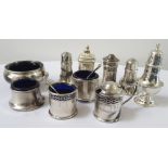 SELECTION OF GEORGE V AND LATER SILVER CONDIMENTS including a lidded mustard, salt and pepper pot,