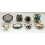 EIGHT SILVER RINGS of various sizes and designs, including emerald, turquoise,