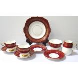 OLD ROYAL BONE CHINA TEA SERVICE decorated with gilt floral scrolls on a claret ground,