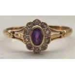 AMETHYST AND DIAMOND CLUSTER RING the central oval cut amethyst in ten diamond surround,