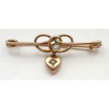 SEED PEARL SET NINE CARAT GOLD BROOCH the entwined setting with central seed pearl above heart drop