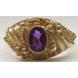 AMETHYST SINGLE STONE RING the central oval cut amethyst in elaborate Rococo style setting,