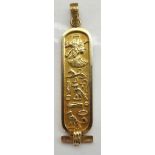 EGYPTIAN EIGHTEEN CARAT GOLD CARTOUCHE PENDANT with Egyptian bust and hieroglyph style decoration,