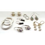 SEVEN PAIRS OF SILVER EARRINGS of various designs,