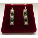 PAIR OF EMERALD AND SEED PEAL EARRINGS the alternate emeralds and seed pearls in vertical settings,