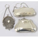 THREE GEORGE V SILVER LADIES EVENING PURSES the first with a shaped and embossed body,