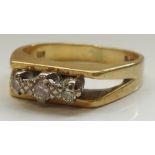 GRADUATED DIAMOND THREE STONE RING on eighteen carat gold shank,