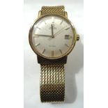 1960s GENTLEMAN'S 'OMEGA DE VILLE' EIGHTEEN CARAT YELLOW GOLD WRISTWATCH the circular dial with