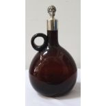 UNMARKED SILVER COLLARED AMBER GLASS DECANTER with associated unmarked silver stopper modelled as a