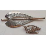 TWO SILVER BROOCHES one of stylised motif design,