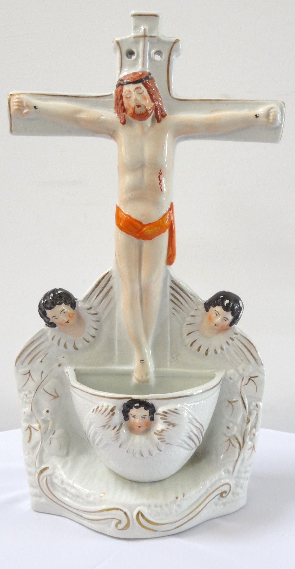 19th CENTURY STAFFORDSHIRE HOLY WATER FONT modelled as Christ on the Cross,