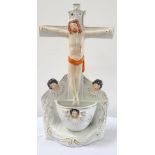 19th CENTURY STAFFORDSHIRE HOLY WATER FONT modelled as Christ on the Cross,