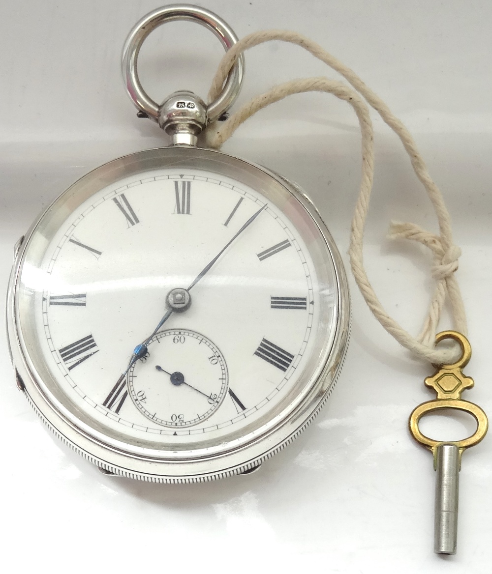 VICTORIAN SILVER CASED POCKET WATCH the circular enamelled dial with Roman numerals and a