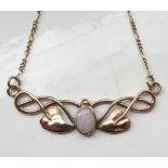 ART NOUVEAU STYLE OPAL SET NECKLET the pendant section with central opal flanked by pierced scroll