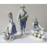 THREE GEROLD FIGURINES depicting a farmer sowing seeds, 27cm high, a young girl with a calf,