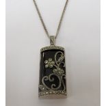 MARCASITE SET SILVER PENDANT with floral decoration,