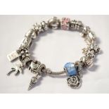 PANDORA MOMENTS SILVER CHARM BRACELET with fourteen charms including a palm tree, a kangaroo,