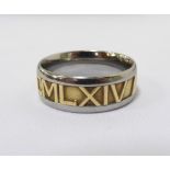 JOHN CHRISTIAN WIDE TWO TONE NUMEROS RING the central eighteen carat yellow gold band with Roman