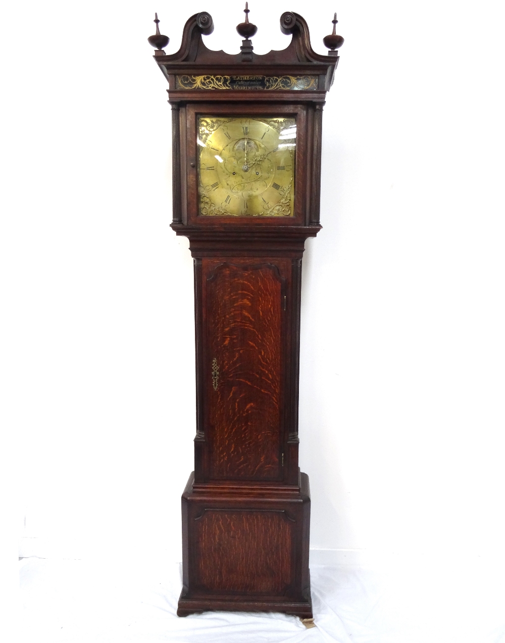 GEORGIAN OAK LONGCASE CLOCK the hood surmounted with a swan neck pediment above a dark glass panel