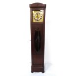 1920s MAHOGANY LONGCASE CLOCK with a brass dial and a silvered chapter ring with Roman numerals,