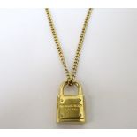 MICHAEL KORS PADLOCK PENDANT in yellow gold tone and on matching long Michael Kors chain