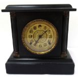 19th CENTURY AMERICAN BLACK SLATE EFFECT MANTEL CLOCK the circular gilt face with Arabic numerals,