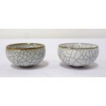 PAIR OF CHINESE PORCELAIN CRACKLE GLAZE BOWLS of circular form, raised on a small foot, 5.