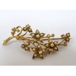 EDWARDIAN SEED PEARL FLORAL SPRAY BROOCH in fifteen carat gold, approximately 5.