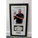 'DARREN CLARKE' THE OPEN CHAMPION 2011 a signed left hand glove and accompanying photograph holding