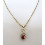 RUBY AND DIAMOND PENDANT the pear cut ruby in diamond set nine carat gold twist setting,