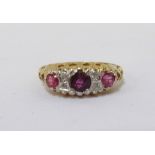 RUBY AND DIAMOND RING on nine carat gold shank,