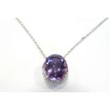 AMETHYST AND DIAMOND PENDANT the large oval cut amethyst approximately 7cts with small diamonds