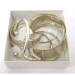 SIX SILVER BANGLES of various sizes and designs including a large cuff example (6)