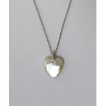 DIAMOND SET MOTHER OF PEARL HEART PENDANT on eighteen carat white gold chain,