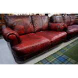 RED LEATHER THREE SEATER SETTEE