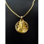 FOURTEEN CARAT GOLD RELIGIOUS PENDANT one side relief decorated with Jesus and the other with the