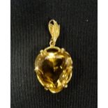 CITRINE SET PENDANT the heart shaped citrine in pierced nine carat gold setting