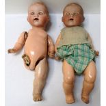 TWO 'ARMAND MARSEILLES' BISQUE HEAD PORCELAIN DOLLS with sleeping eyes and open mouths,