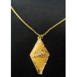 FOURTEEN CARAT GOLD PARTHENON DECORATED PENDANT on fourteen carat gold neck chain,