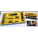1960s HORNBY DUBLO TRAIN SET 00 Gauge, with track laid on table top with attached power packs,