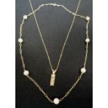 PEARL AND NINE CARAT GOLD NECKLACE the seven pearls evenly spaced around the gold neck chain;