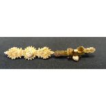 TWO VICTORIAN NINE CARAT GOLD BROOCHES one with central bow and heart drop,