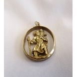 NINE CARAT GOLD SAINT CHRISTOPHER PENDANT the relief moulded figures set to the centre of an oval